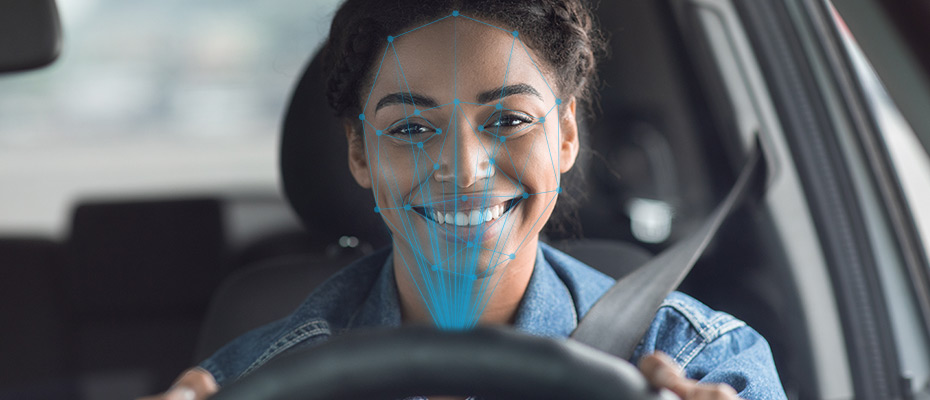 Woman driving while facially recognized by the car